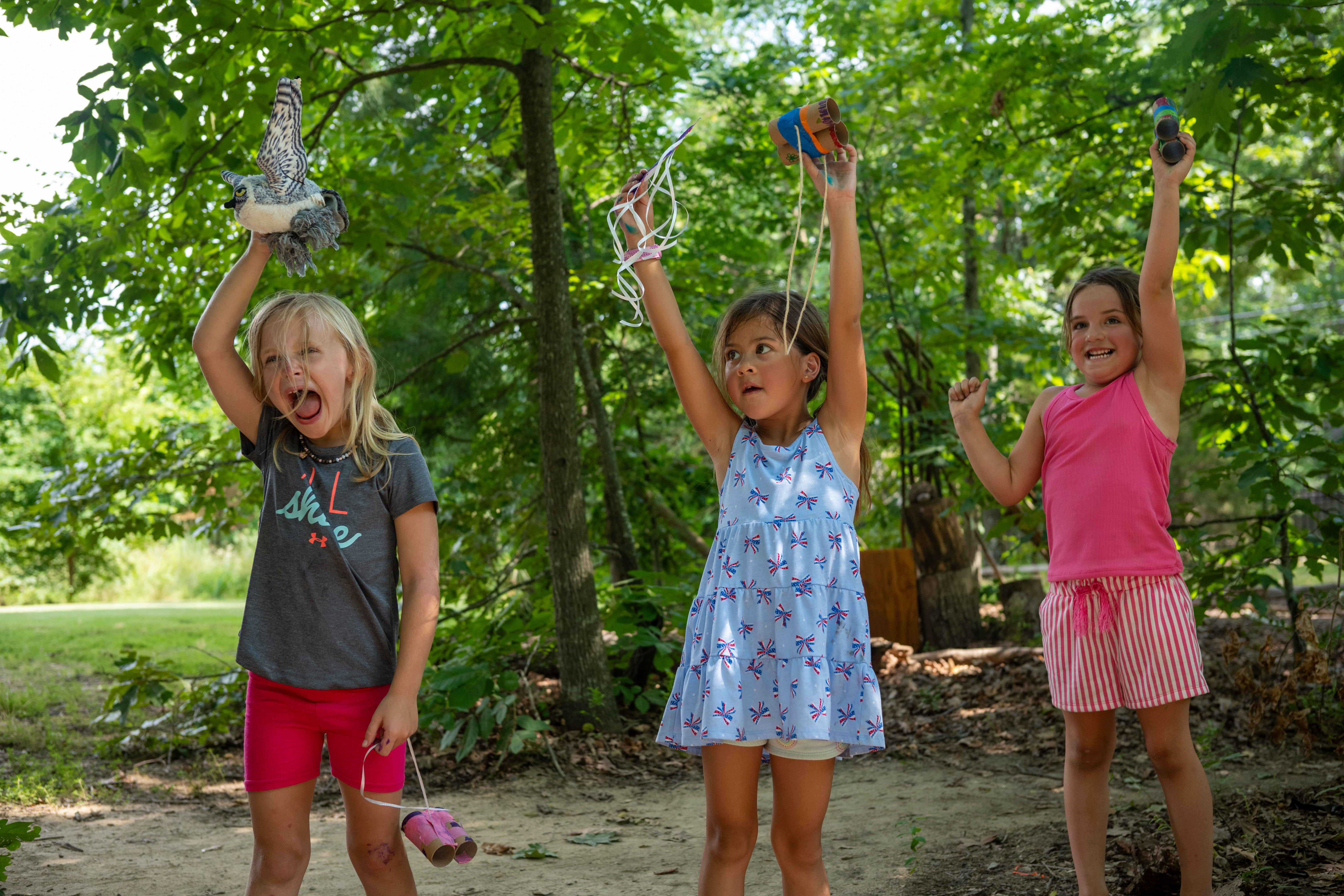 girls showing off binoculars